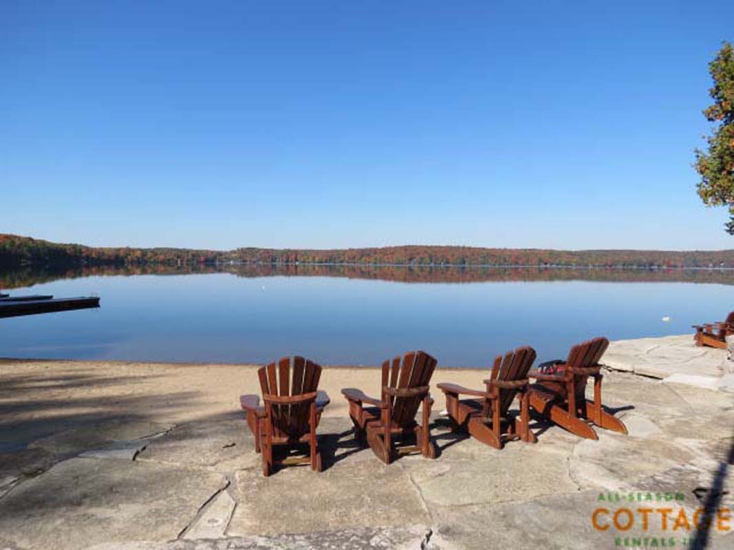 Walk out from cottage on to a large lakeside patio